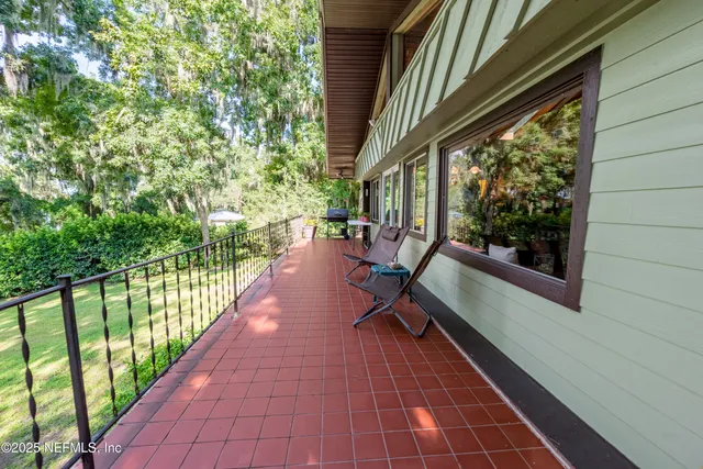 a front view of a house with a yard table and chairs