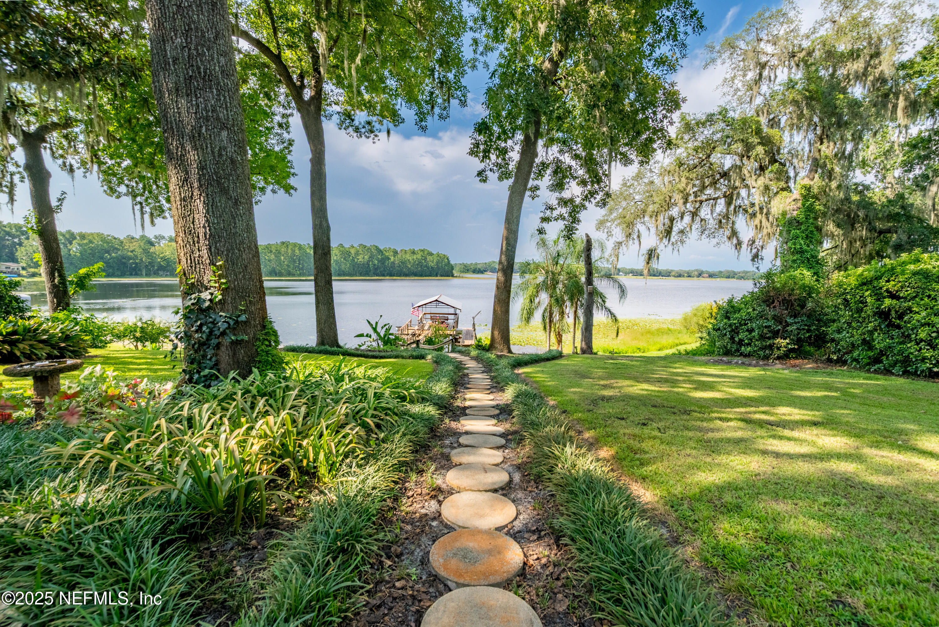 8166 Alderman Road Melrose, FL 32666 - Photo 21 of 94 a view of a garden with a fountain