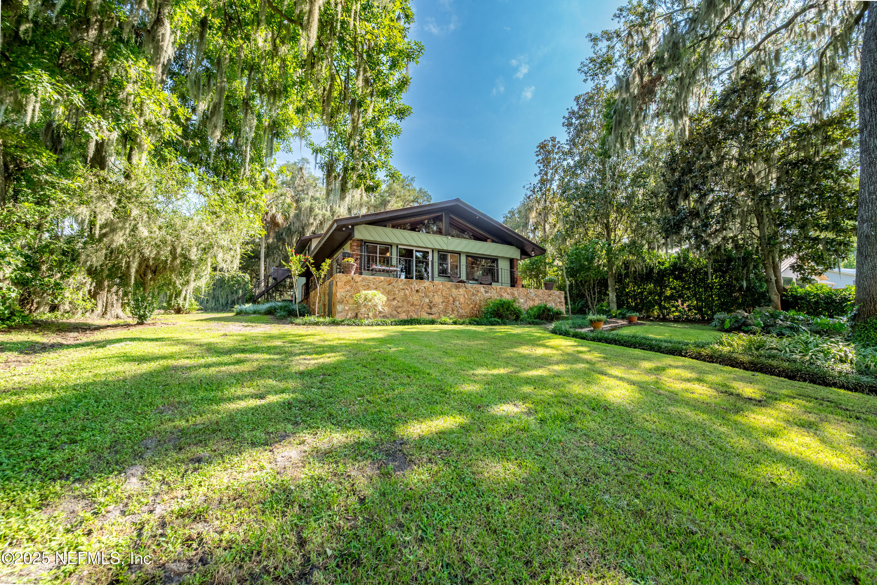 8166 Alderman Road Melrose, FL 32666 - Photo 30 of 94 a view of swimming pool is middle in the garden