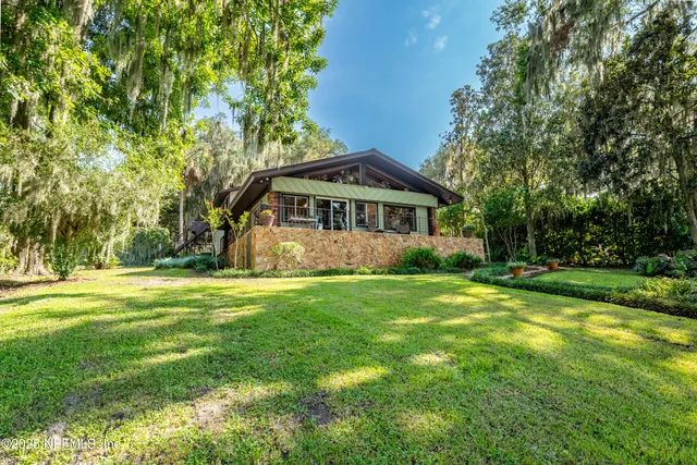 a very nice looking kitchen with kitchen island granite countertop a large window