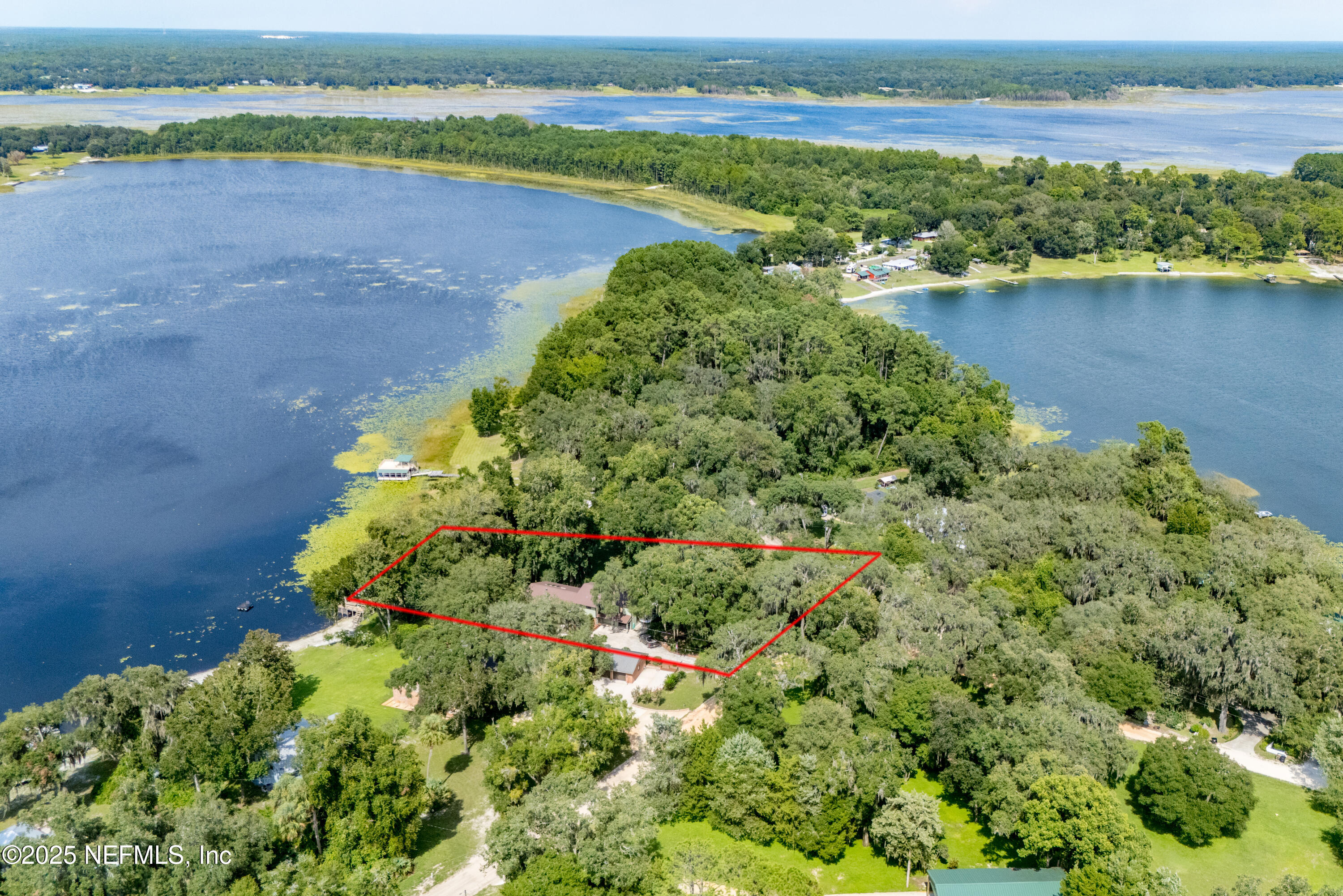 8166 Alderman Road Melrose, FL 32666 - Photo 39 of 94 a view of a lake with a city view