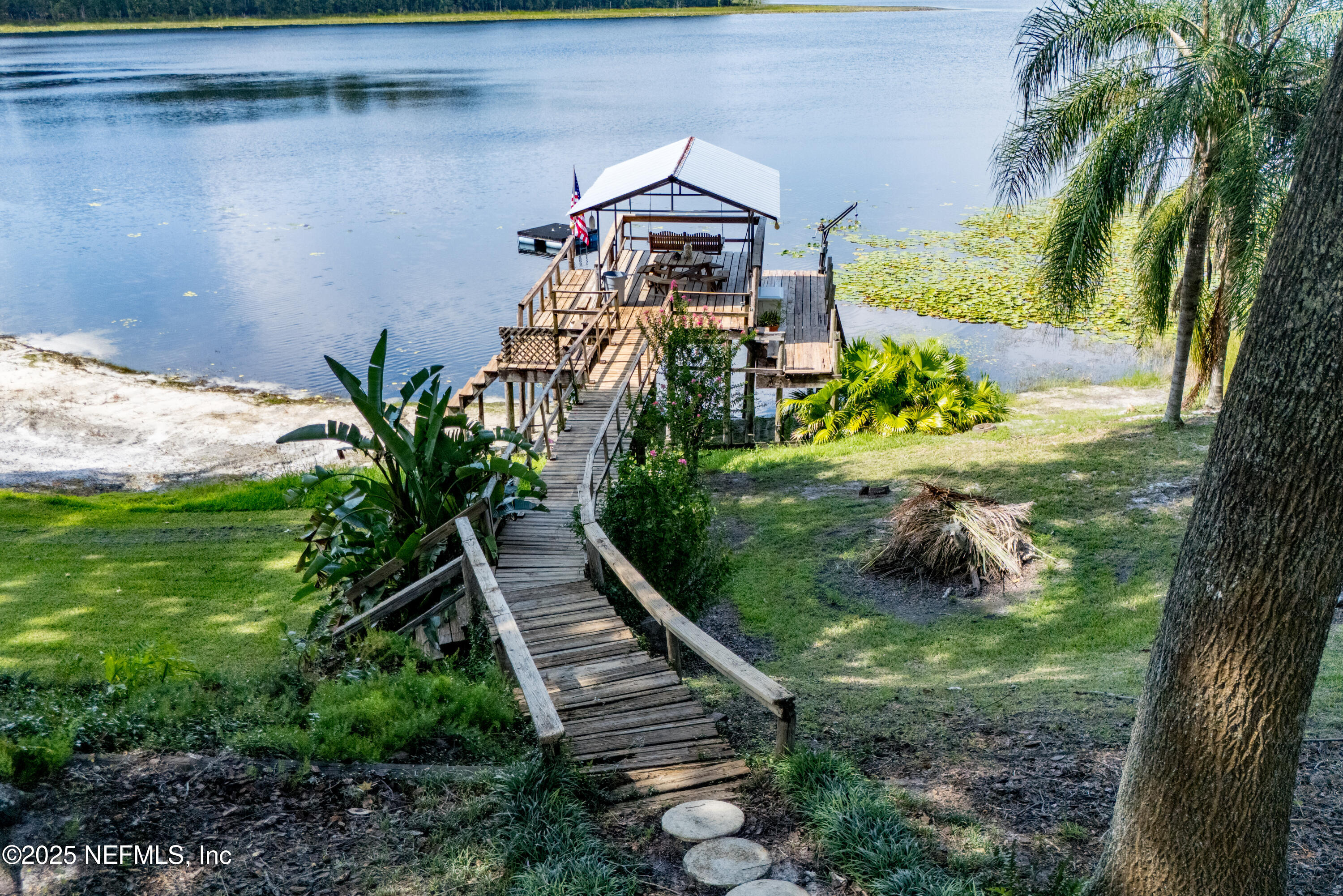 8166 Alderman Road Melrose, FL 32666 - Photo 51 of 94 a view of a house with a yard