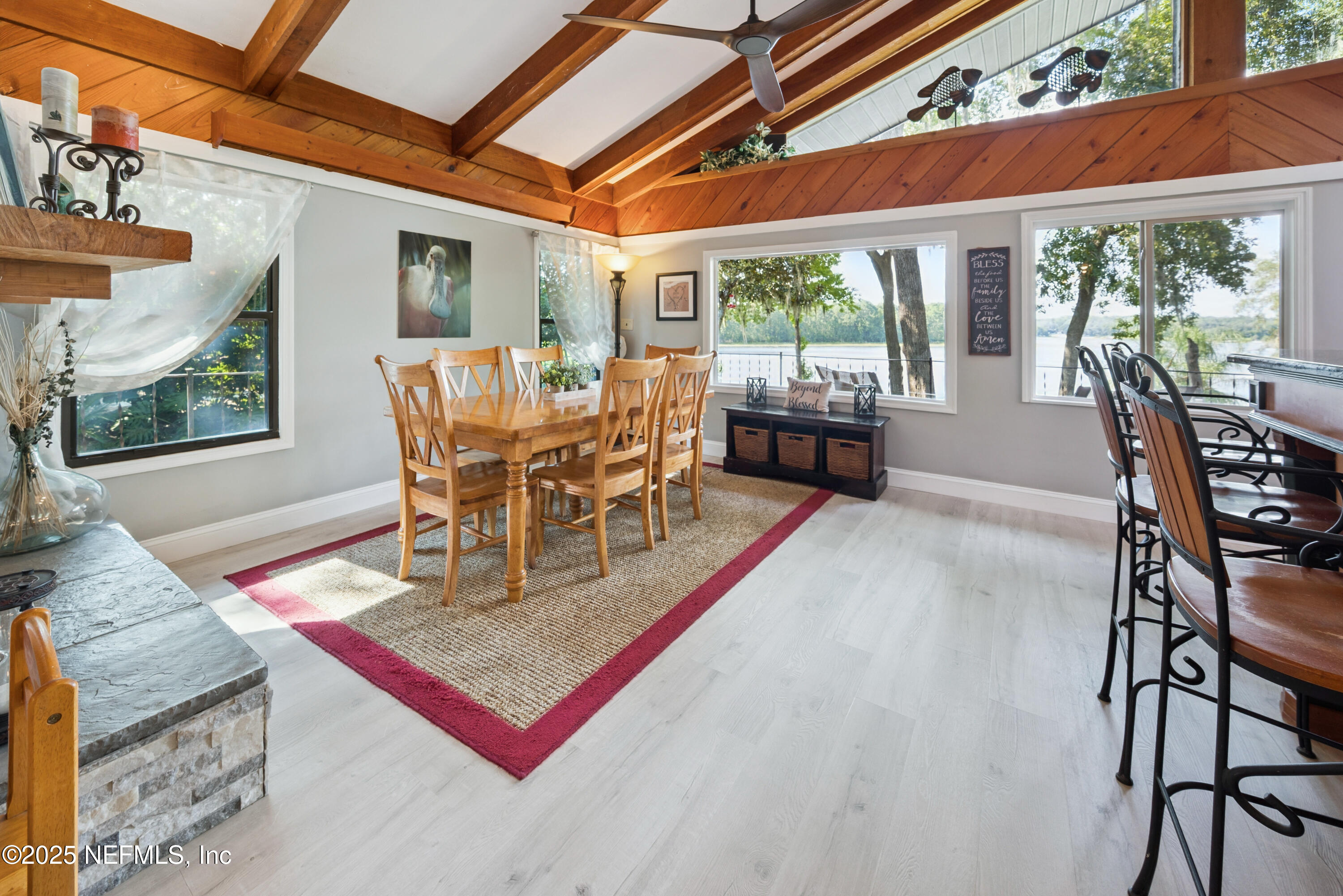 8166 Alderman Road Melrose, FL 32666 - Photo 61 of 94 a view of a dining room with furniture window and outside view
