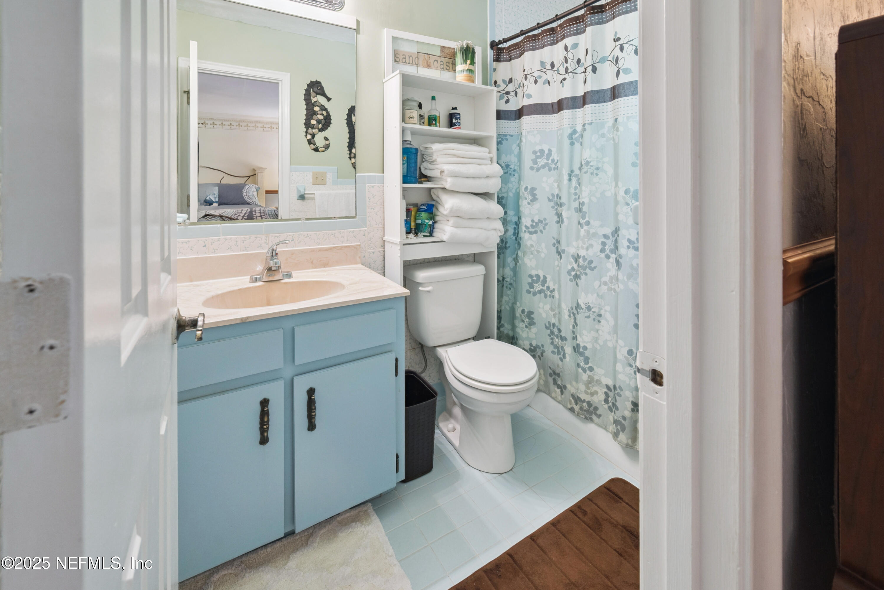 8166 Alderman Road Melrose, FL 32666 - Photo 79 of 94 a bathroom with a sink toilet and shower