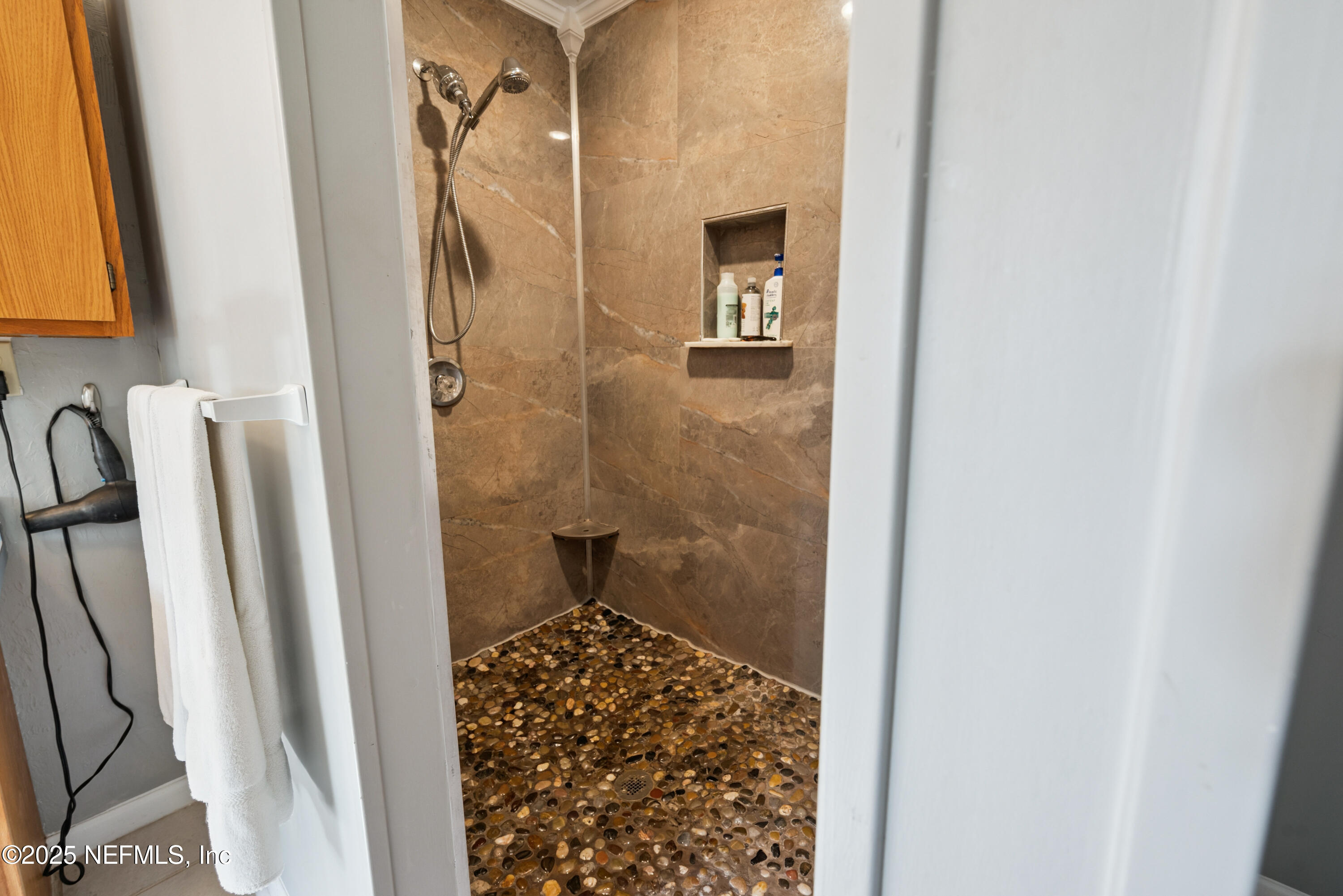 8166 Alderman Road Melrose, FL 32666 - Photo 88 of 94 a bathroom with a shower and a sink