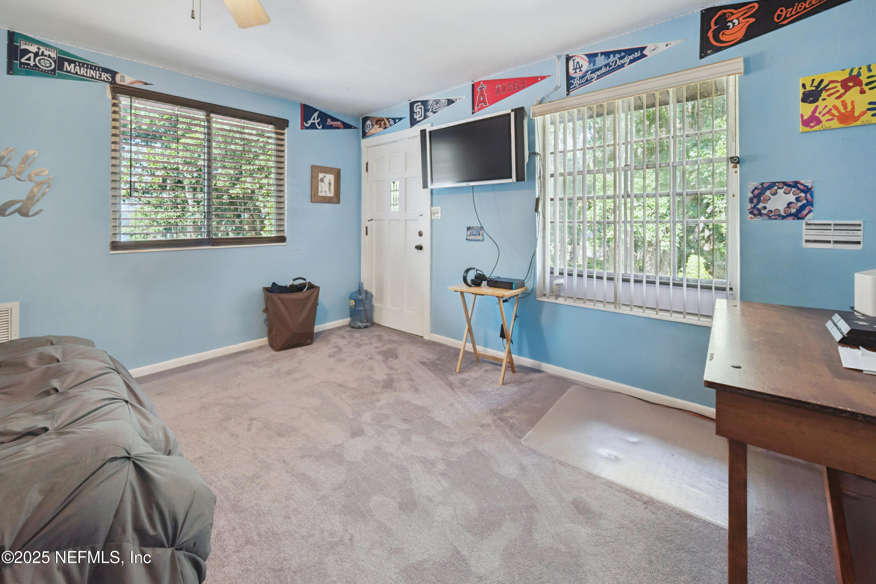 8166 Alderman Road Melrose, FL 32666 - Photo 89 of 94 a bedroom with a bed and a window