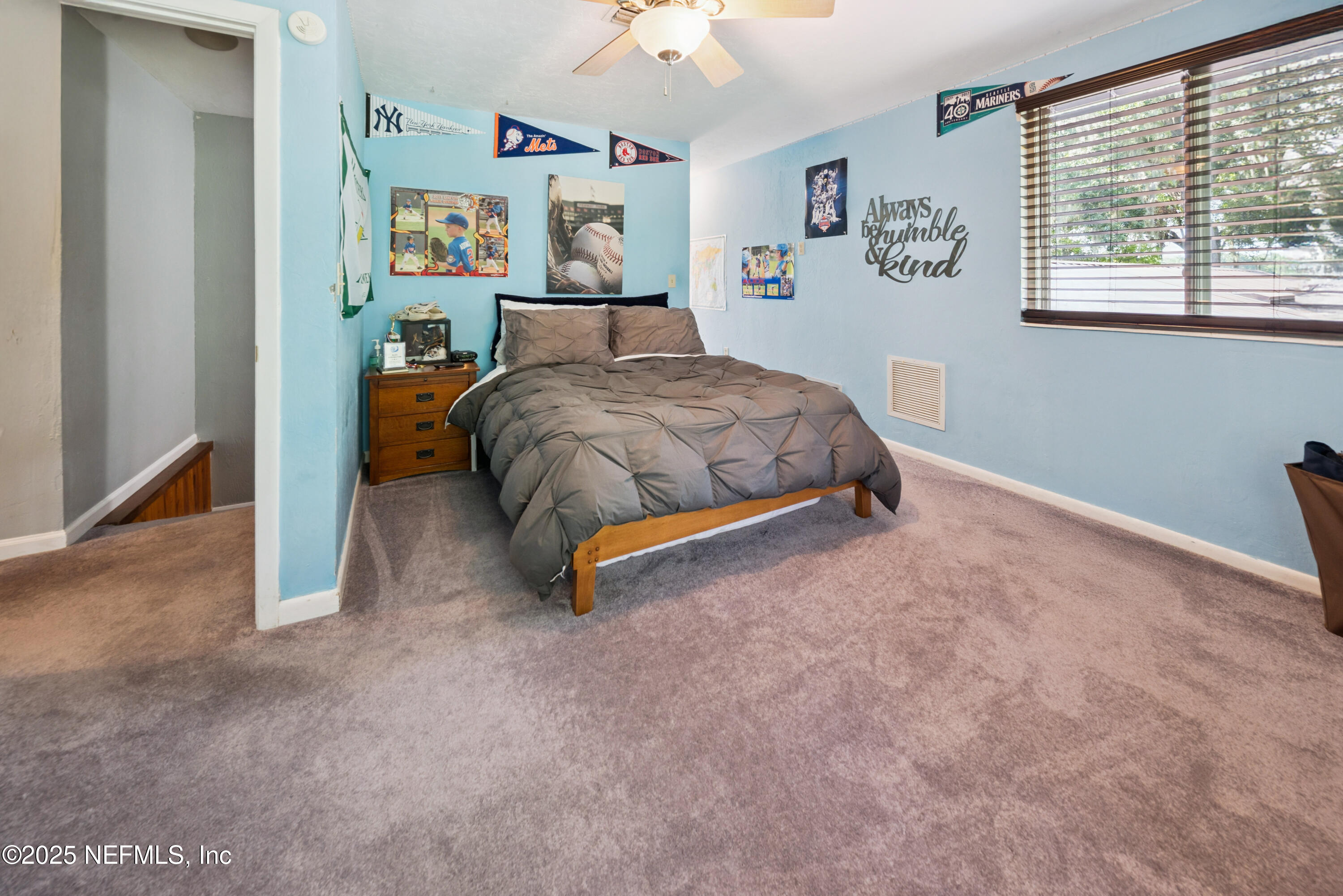 8166 Alderman Road Melrose, FL 32666 - Photo 90 of 94 a bedroom with a bed and a window