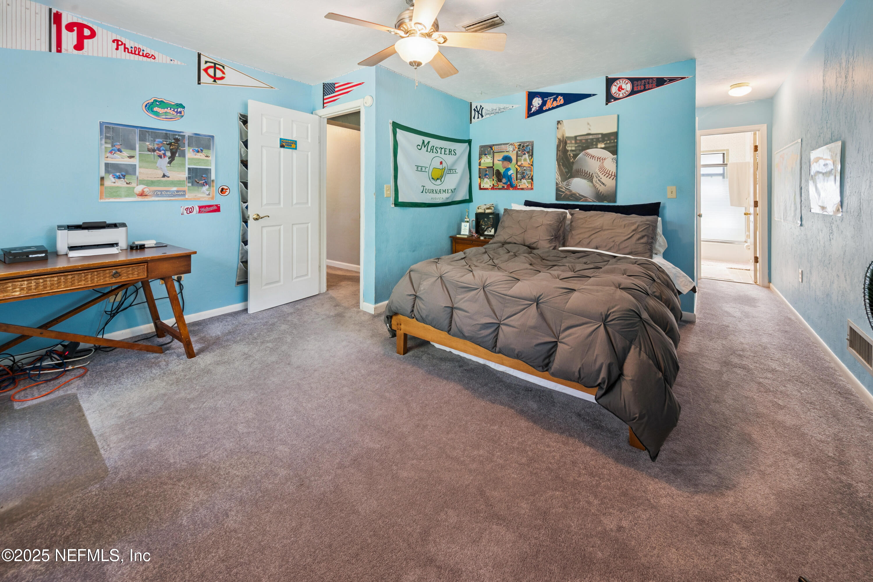 8166 Alderman Road Melrose, FL 32666 - Photo 91 of 94 a bedroom with a bed and a desk