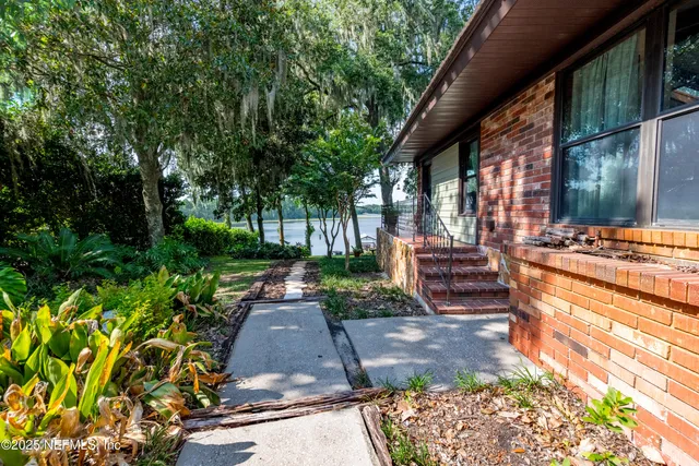 a view of swimming pool is middle in the garden