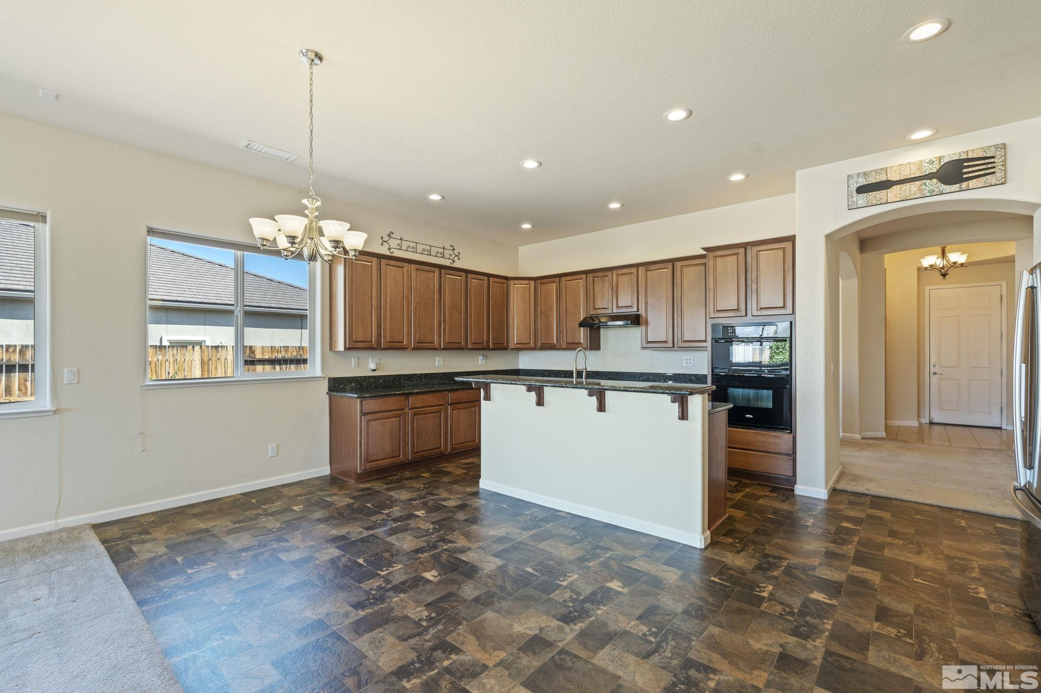 10295 Cavalry Circle Reno, NV 89521 - Photo 14 of 40 a kitchen with a sink and cabinets