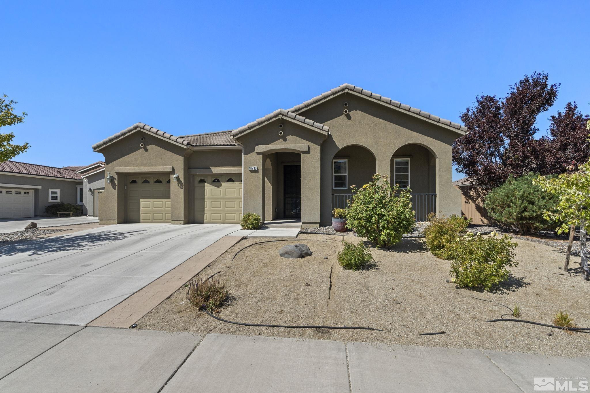 10295 Cavalry Circle Reno, NV 89521 - Photo 2 of 40 a view of a house with a yard