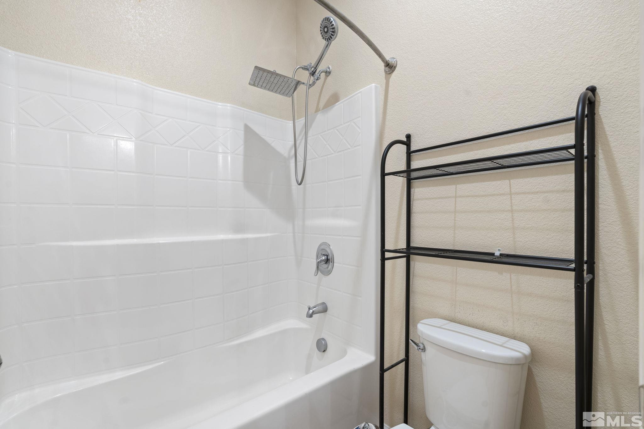 10295 Cavalry Circle Reno, NV 89521 - Photo 30 of 40 a bathroom with a shower and a toilet