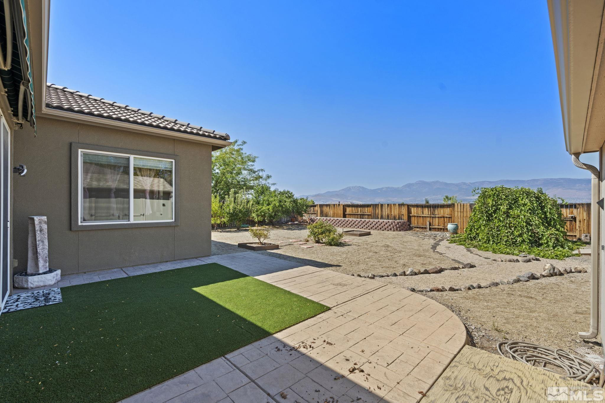 10295 Cavalry Circle Reno, NV 89521 - Photo 34 of 40 a view of a backyard with a garden and plants