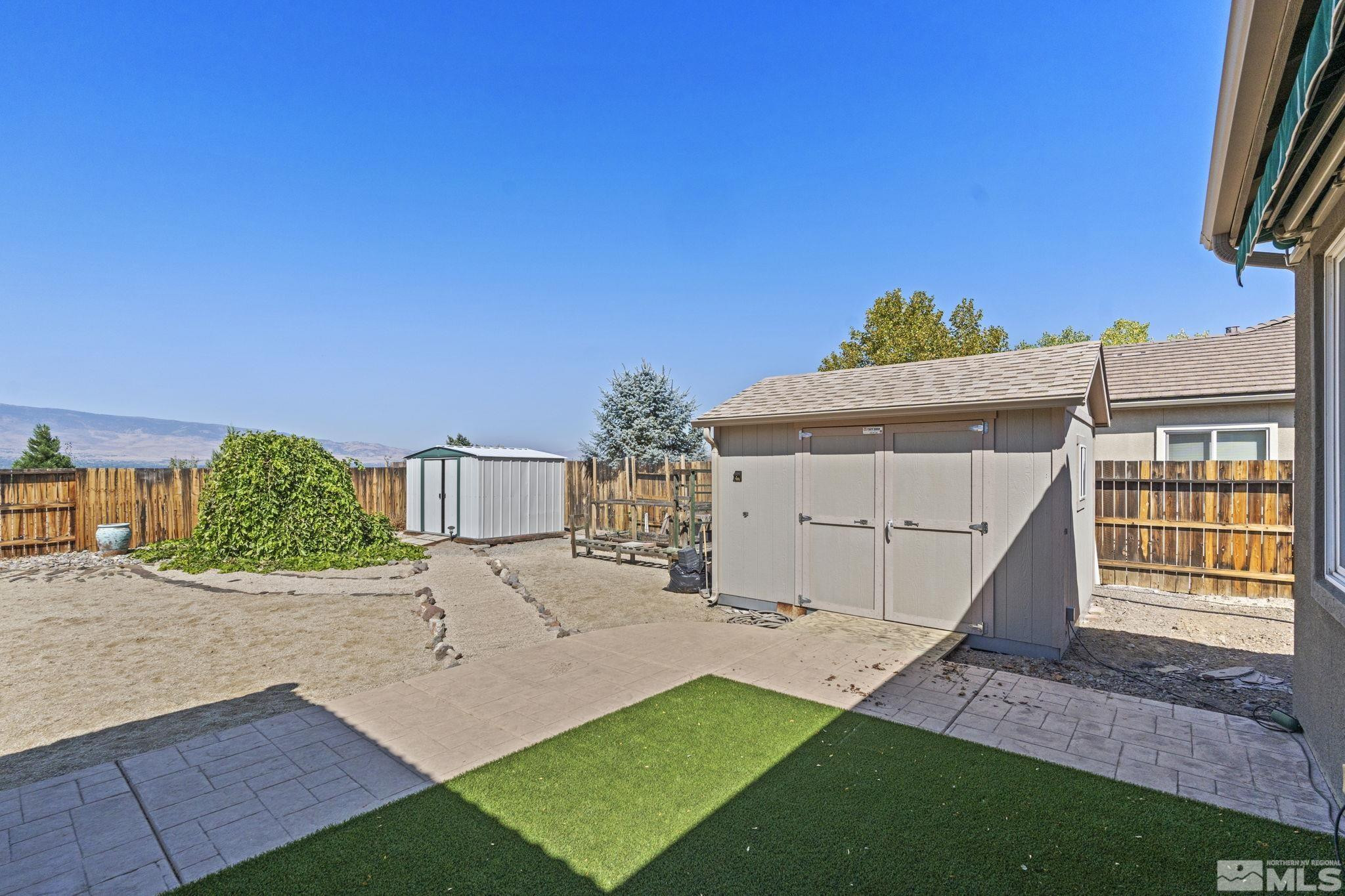 10295 Cavalry Circle Reno, NV 89521 - Photo 35 of 40 a view of a house with a yard and garage