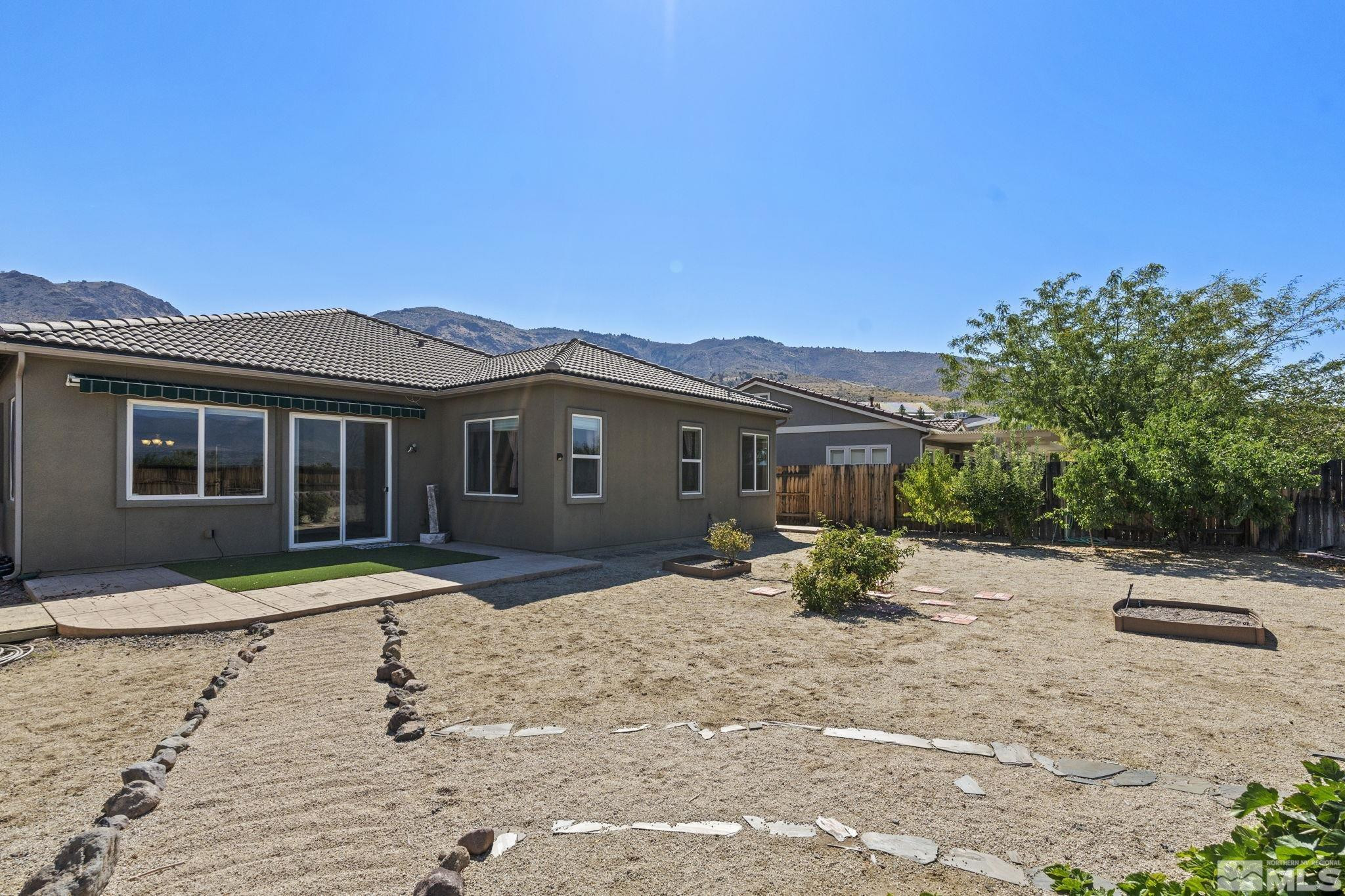10295 Cavalry Circle Reno, NV 89521 - Photo 36 of 40 a view of a house with backyard