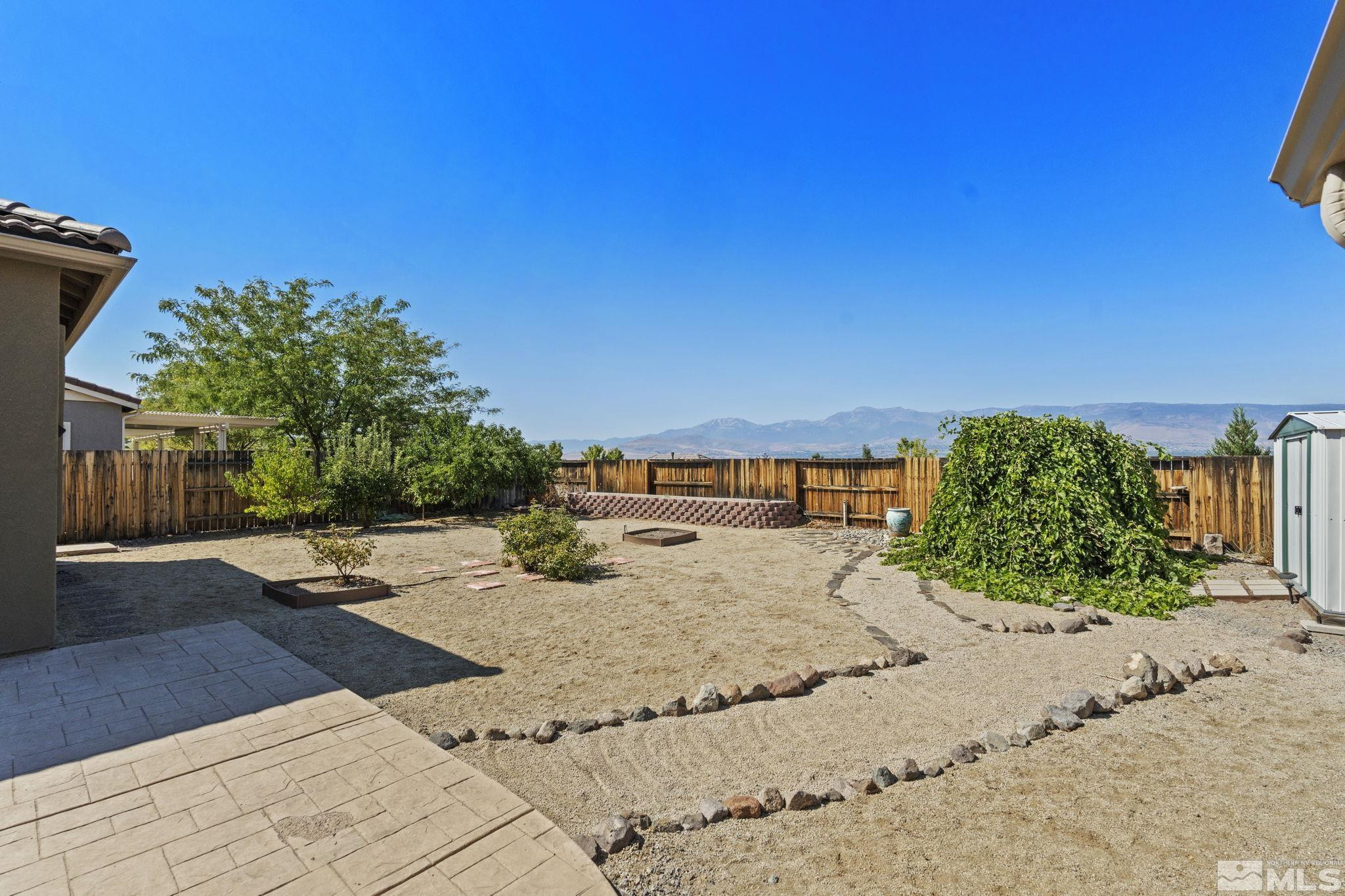 10295 Cavalry Circle Reno, NV 89521 - Photo 39 of 40 a view of a swimming pool with an outdoor space and seating area