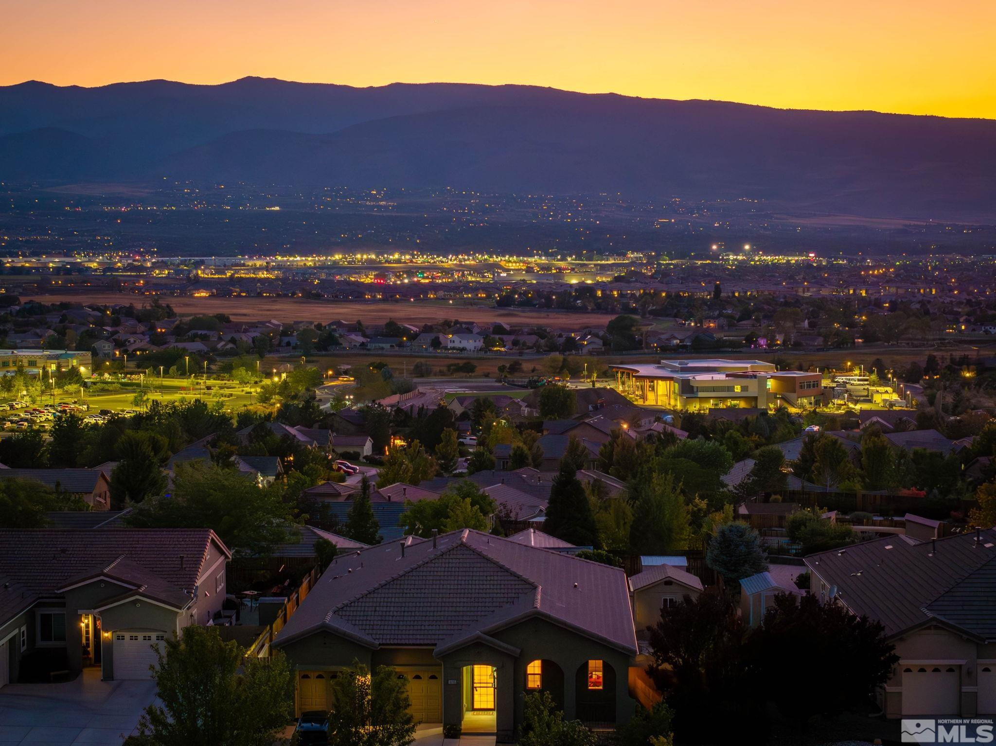 10295 Cavalry Circle Reno, NV 89521 - Photo 4 of 40 a view of a city with lots of residential buildings ocean and mountain view in back