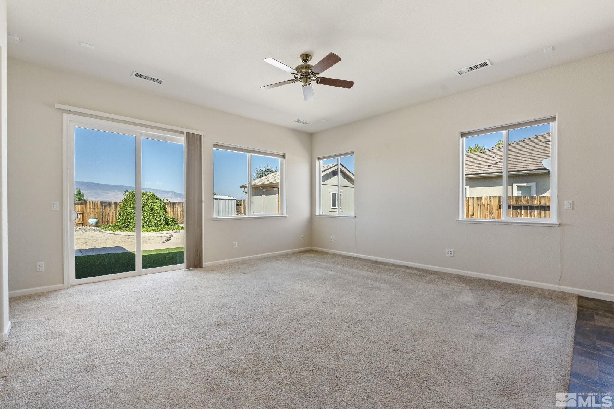 10295 Cavalry Circle Reno, NV 89521 - Photo 6 of 40 a view of an empty room with a window