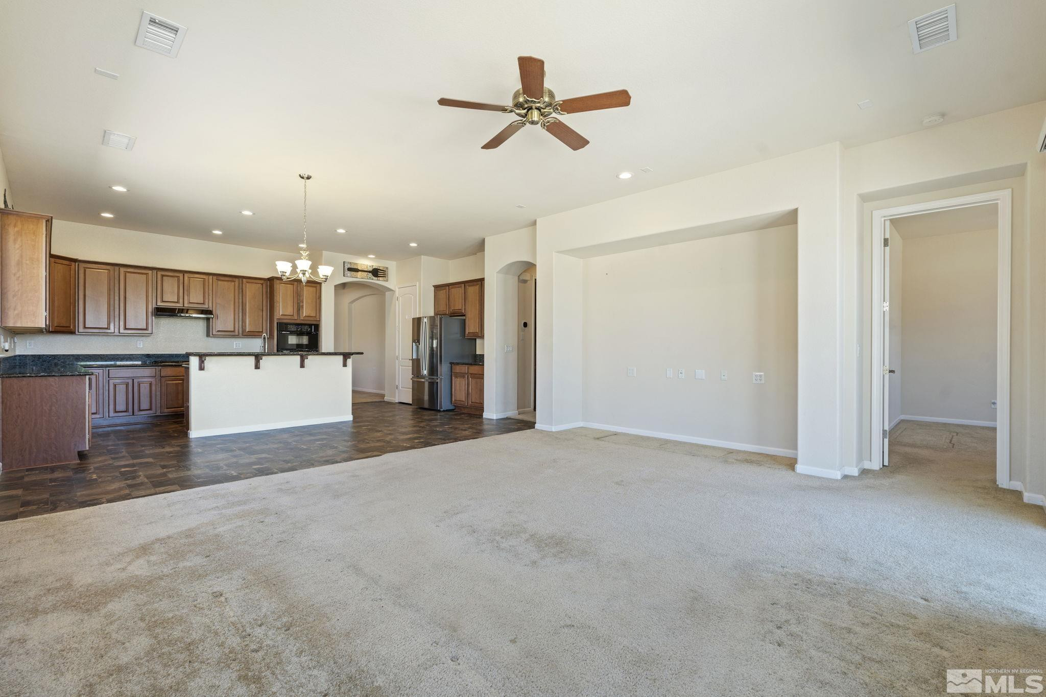 10295 Cavalry Circle Reno, NV 89521 - Photo 9 of 40 a view of a kitchen with a sink and a refrigerator