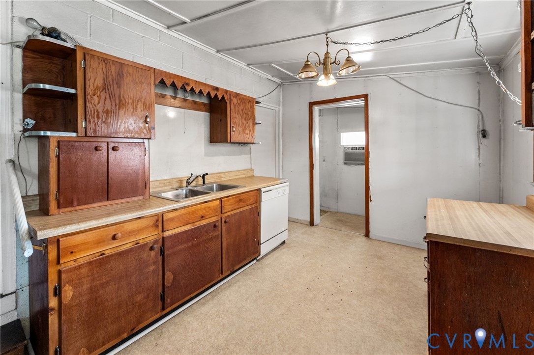 19161 Hollowing Creek Road Beaverdam, VA 23015 - Photo 23 of 27 a kitchen with stainless steel appliances granite countertop a refrigerator and a stove top oven