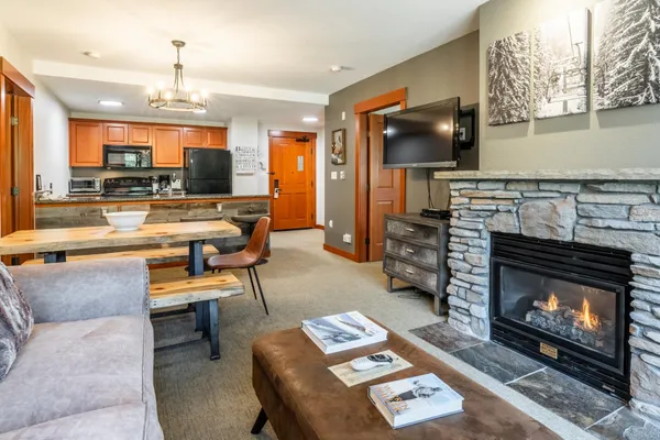 a living room with furniture and a fireplace
