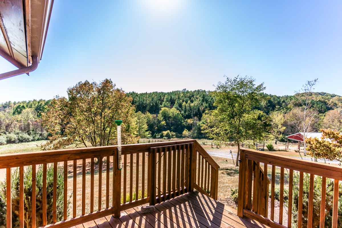 917 Roman Road Mount Sidney, VA 24467 - Photo 30 of 45 a view of a balcony with wooden fence and floor