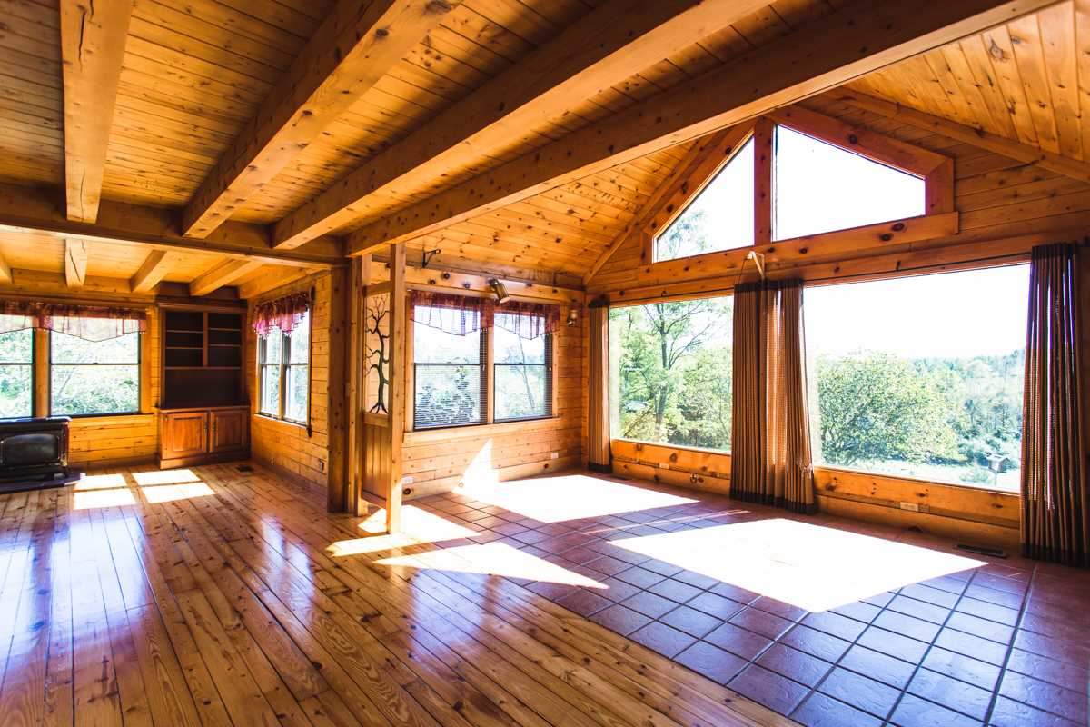 917 Roman Road Mount Sidney, VA 24467 - Photo 3 of 45 a view of an empty room with wooden floor and a window