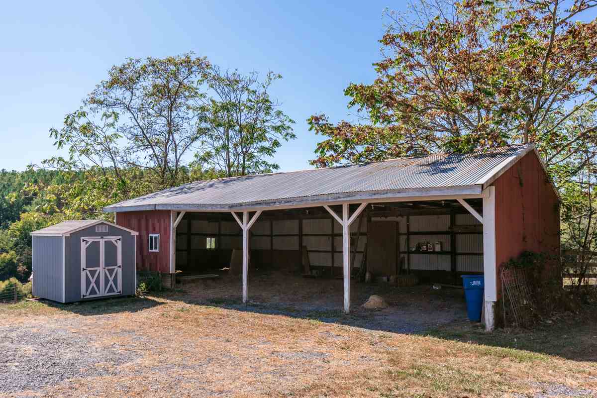 917 Roman Road Mount Sidney, VA 24467 - Photo 31 of 45 a view of a barn with a large window and a large tree