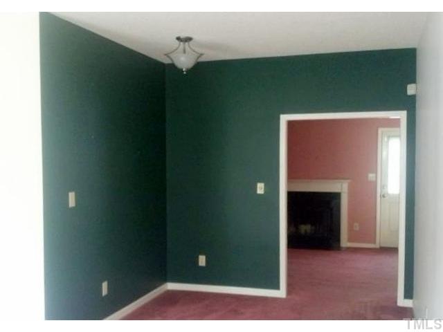 1815 Collier Road Durham, NC 27707 - Photo 2 of 7 a view of livingroom and hall with a fireplace