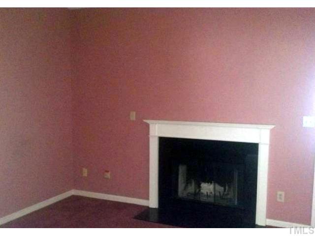 1815 Collier Road Durham, NC 27707 - Photo 3 of 7 a room with a fireplace