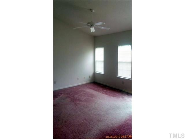 1815 Collier Road Durham, NC 27707 - Photo 5 of 7 a view of an empty room with a window