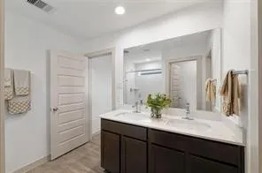 a bathroom with a sink and shower