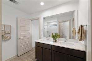 8027 Milam Lane Rosharon, TX 77583 - Photo 13 of 18 a bathroom with a sink and a mirror