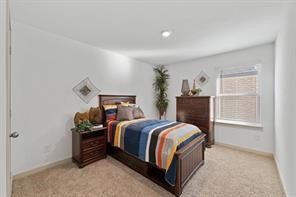 8027 Milam Lane Rosharon, TX 77583 - Photo 16 of 18 a bed room with a bed and a window