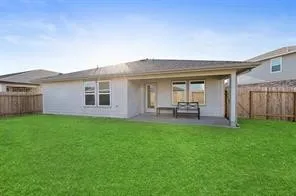 a view of a house with backyard and garden