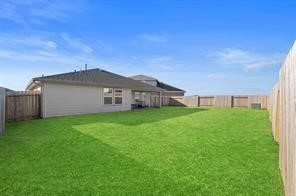 8027 Milam Lane Rosharon, TX 77583 - Photo 18 of 18 a view of a house with backyard and garden
