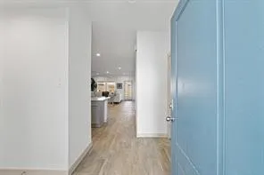 a view of a kitchen from the hallway