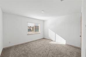 8027 Milam Lane Rosharon, TX 77583 - Photo 4 of 18 an empty room with a window