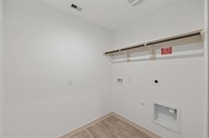 8027 Milam Lane Rosharon, TX 77583 - Photo 5 of 18 a view of storage and utility room with washer and dryer