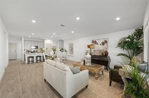 8027 Milam Lane Rosharon, TX 77583 - Photo 6 of 18 a living room with furniture and a potted plant