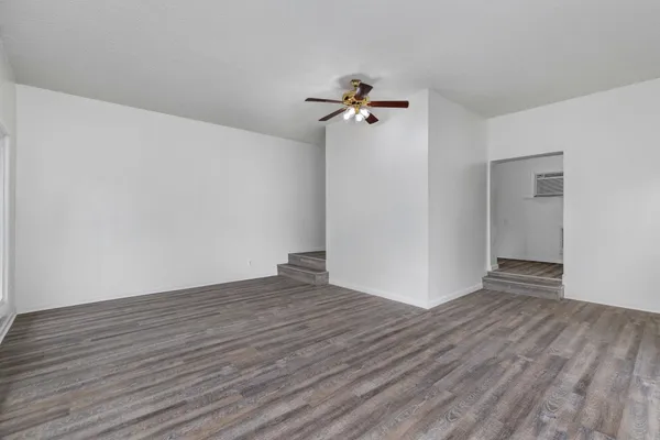 a view of a livingroom with wooden floor
