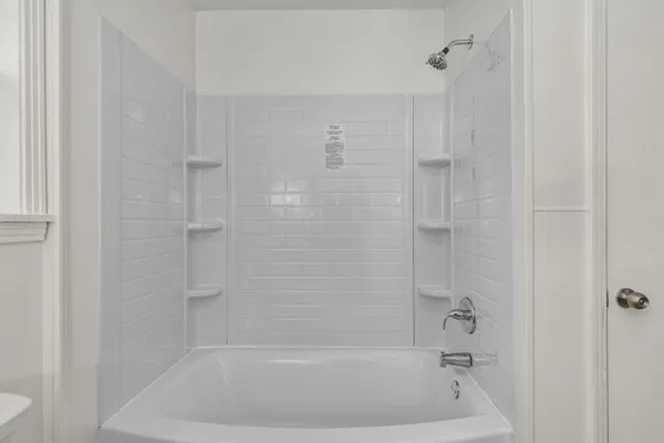 a close view of a bathtub in bathroom