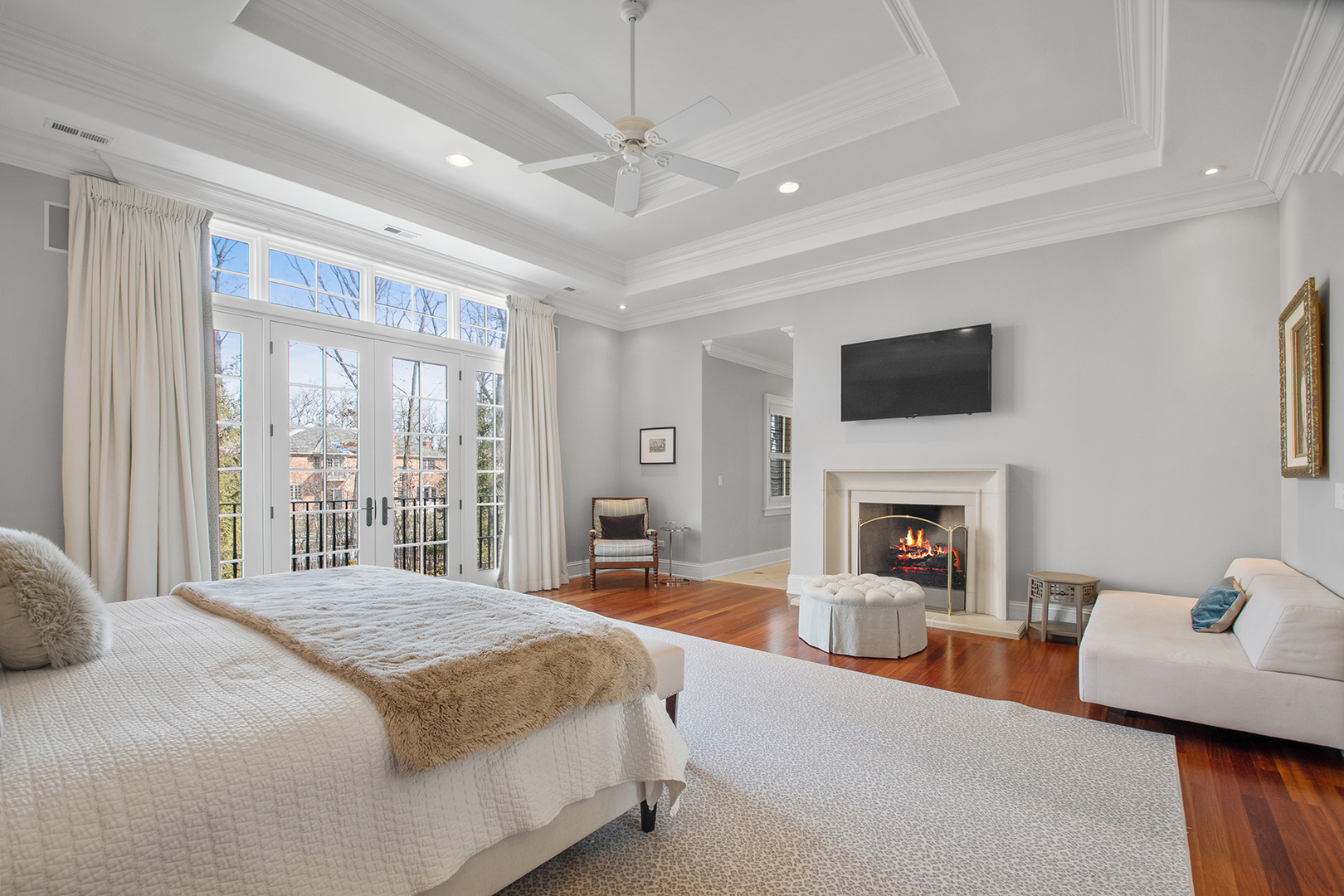20 Old Mill Road Lake Forest, IL 60045 - Photo 34 of 64 a spacious bedroom with a large bed and a fireplace