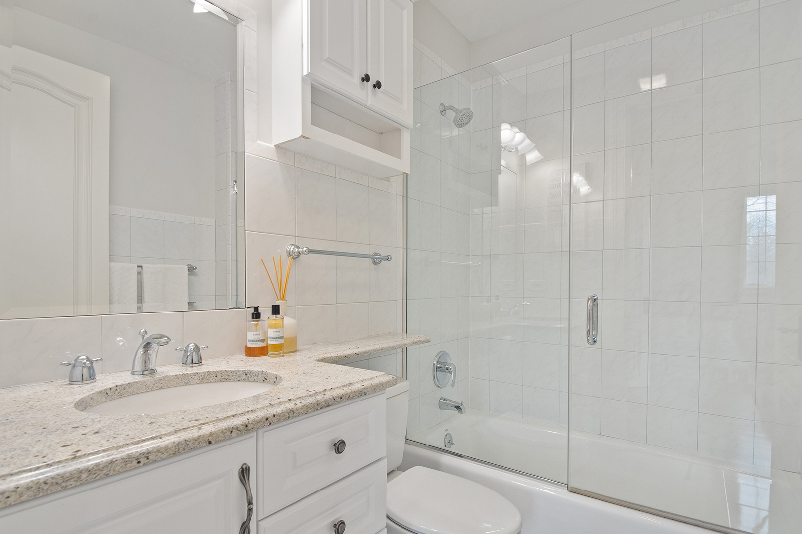 20 Old Mill Road Lake Forest, IL 60045 - Photo 50 of 64 a bathroom with a granite countertop sink a toilet and shower