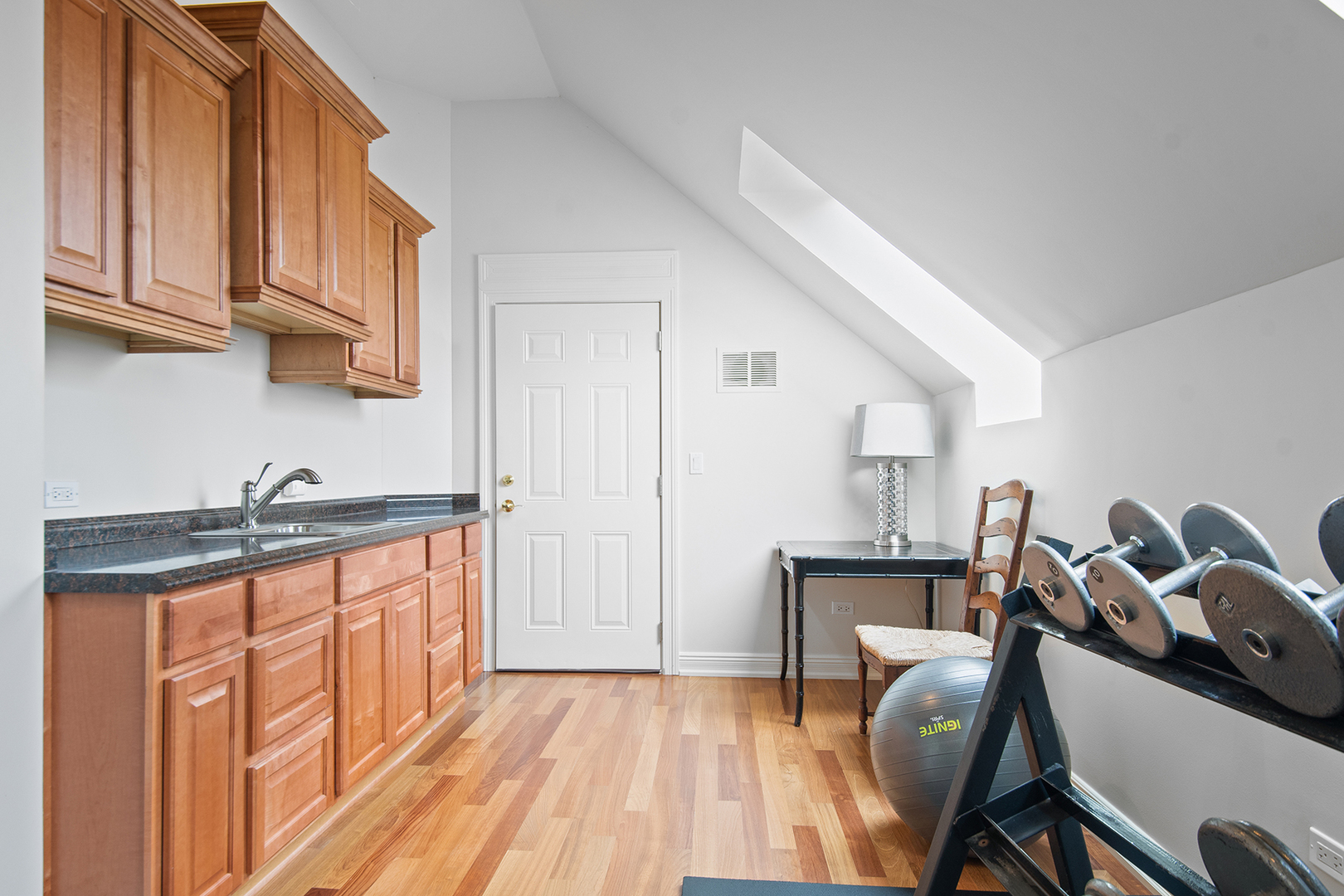 20 Old Mill Road Lake Forest, IL 60045 - Photo 53 of 64 a kitchen with granite countertop a sink cabinets and wooden floor