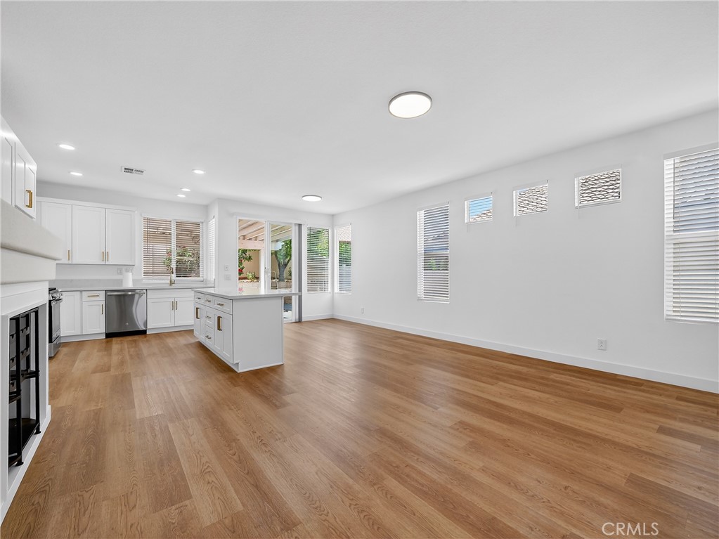 1436 Riviera Avenue Banning, CA 92220 - Photo 13 of 43 a view of kitchen with wooden floor and windows