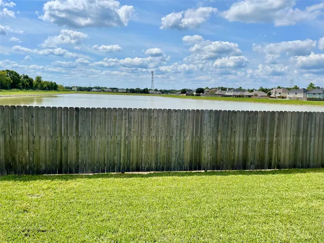 a view of a yard with an outdoor space and barbeque oven