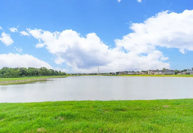 a view of a lake with a big yard