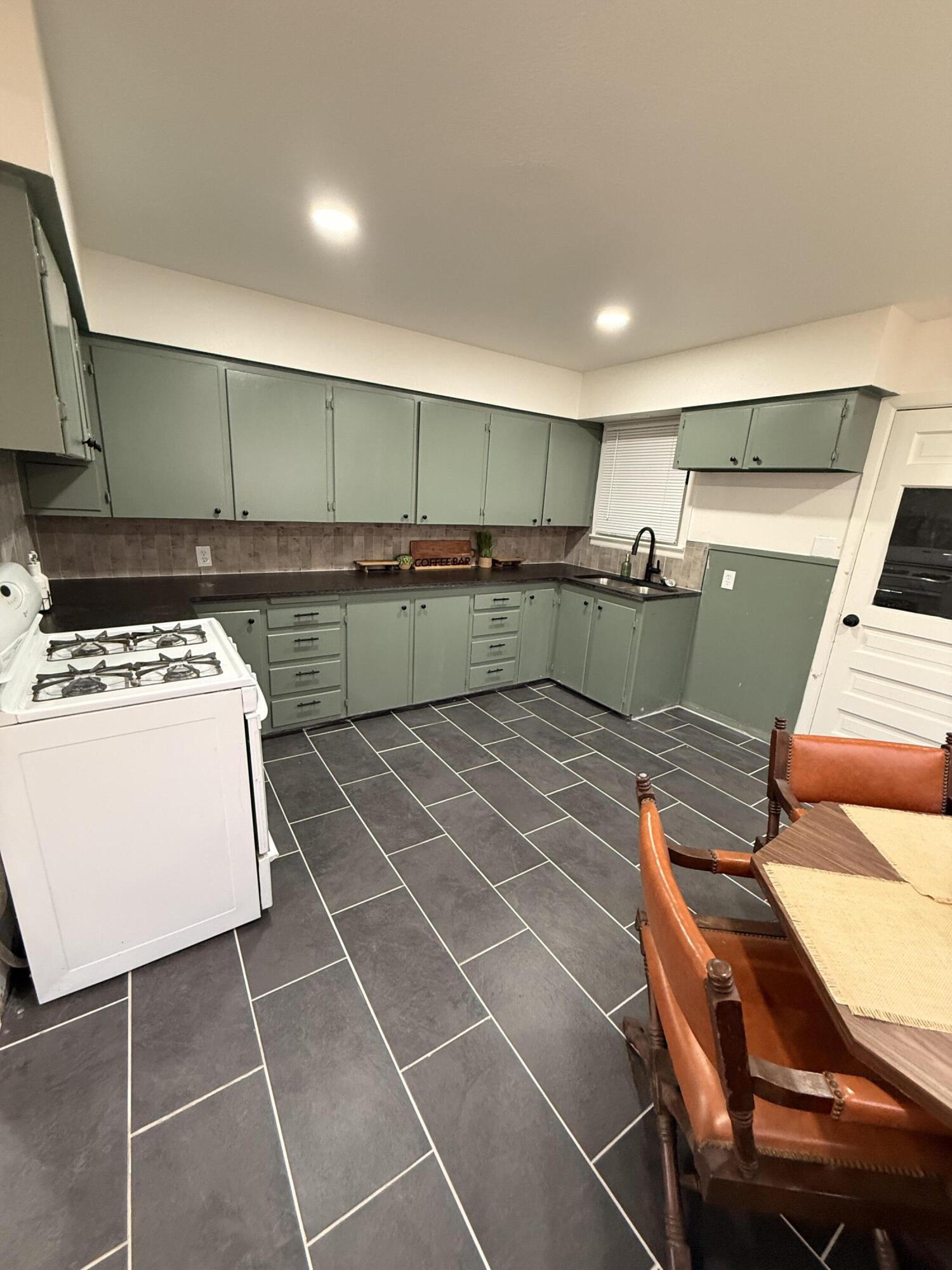 4601 43rd Street Lubbock, TX 79414 - Photo 11 of 12 a kitchen with lots of counter space and a sink