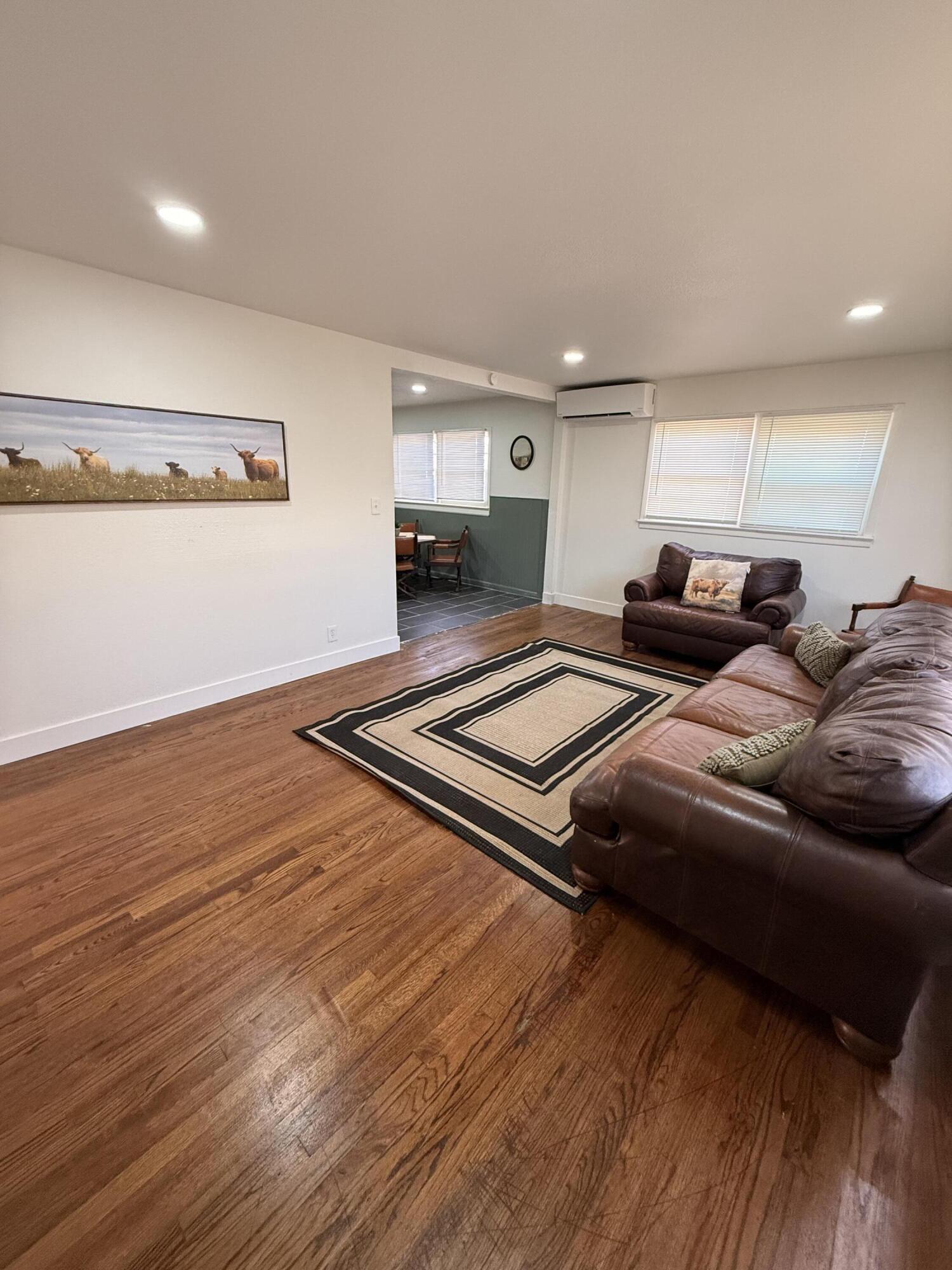 4601 43rd Street Lubbock, TX 79414 - Photo 9 of 12 a bedroom with two beds and a night stand